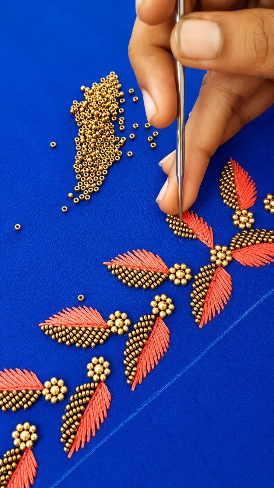 Artisan creating handcrafted Aari embroidery